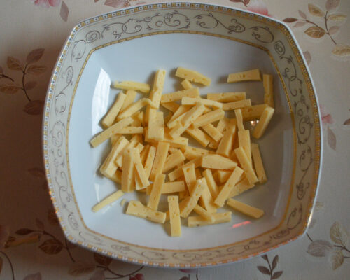 Cut the cheese into sticks