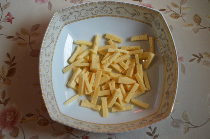 Cut the cheese into sticks