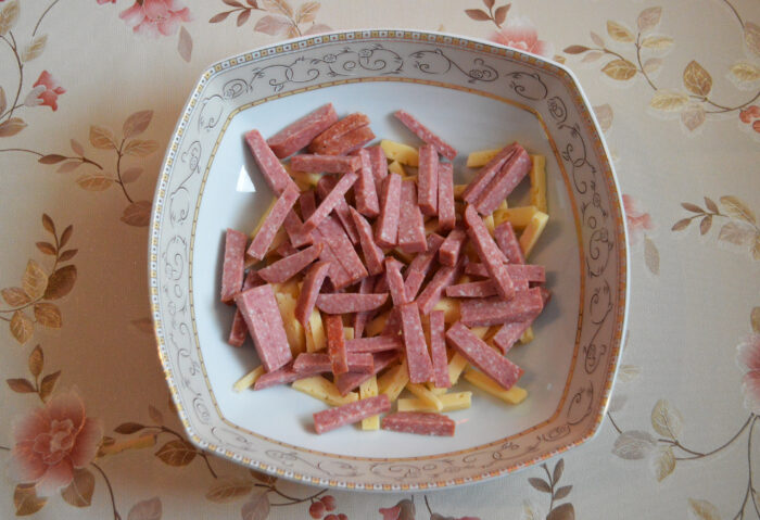 Cut the salami into sticks