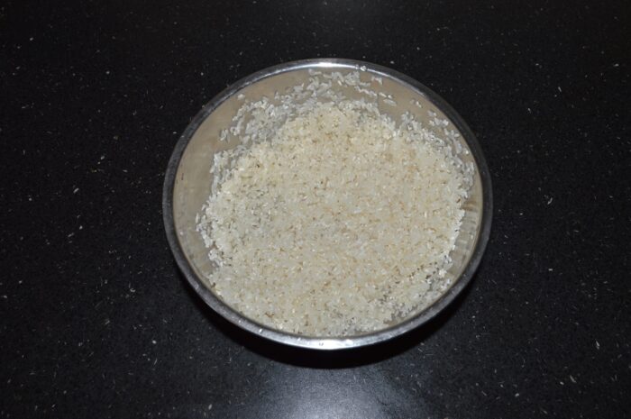 Wash the rice in several changes of water
