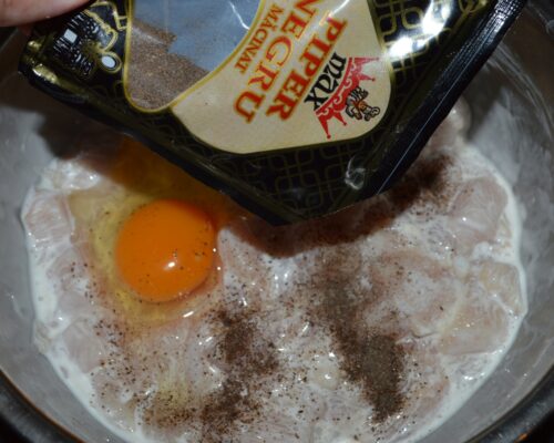 Sprinkle ground black pepper