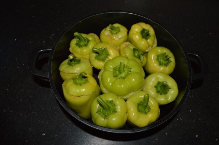 Place the cut tops over the stuffed peppers