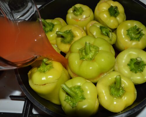 Pour the mixture of water and tomato juice into the pot