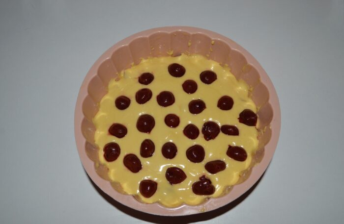 Arrange the cherries on top of the mixture