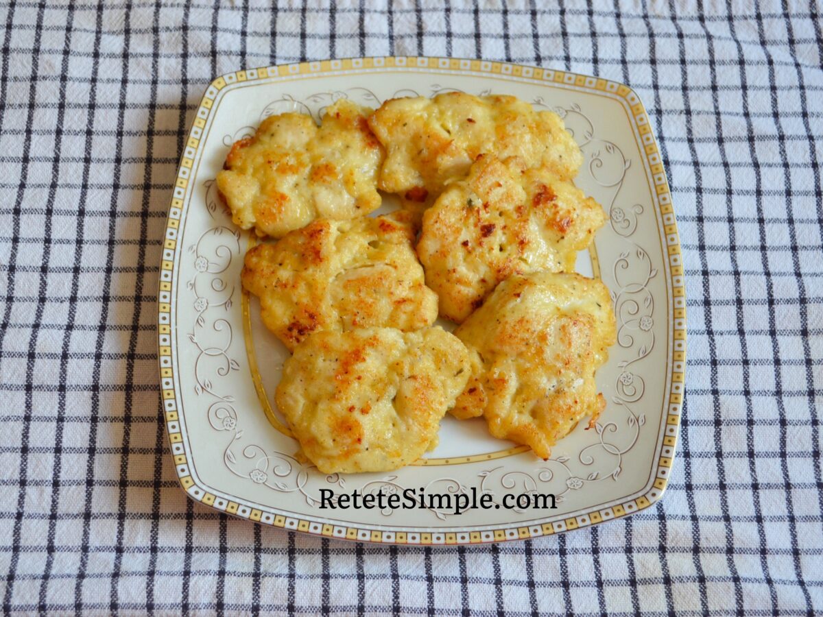 Close‑up of pan‑fried chicken patty with herbs