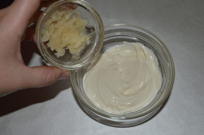 Press garlic and add to mayonnaise