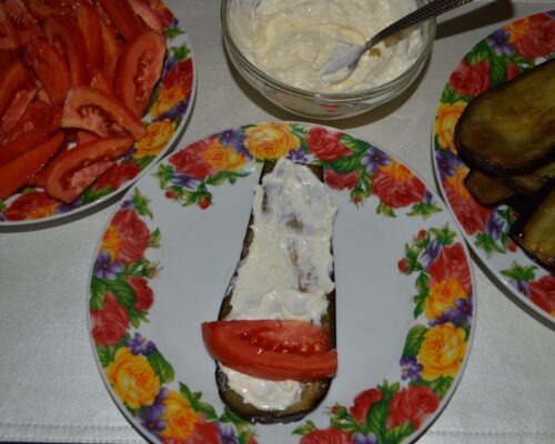 Put a slice of tomato at the end of the slice
