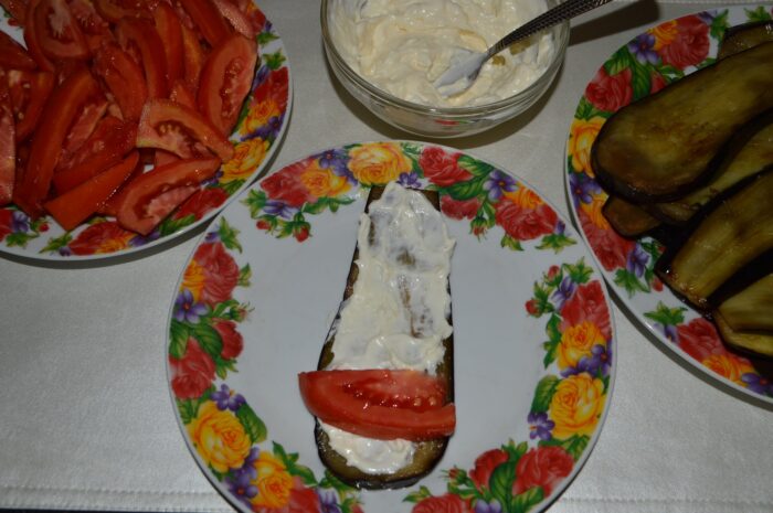 Put a slice of tomato at the end of the slice