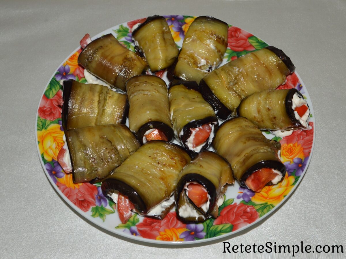 Close-up of creamy garlic-mayo eggplant roll with tomato