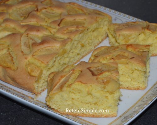 Slice of apple cake showing tender apple topping