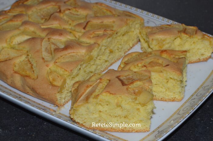 Slice of apple cake showing tender apple topping