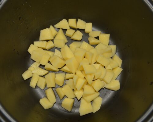 place the diced potatoes in the multicooker bowl
