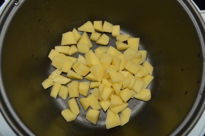 place the diced potatoes in the multicooker bowl