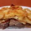 Oven-baked pork and potato French-style dish with cheese crust