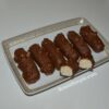 Close-up of chocolate-coated curd cheese bar with hazelnuts