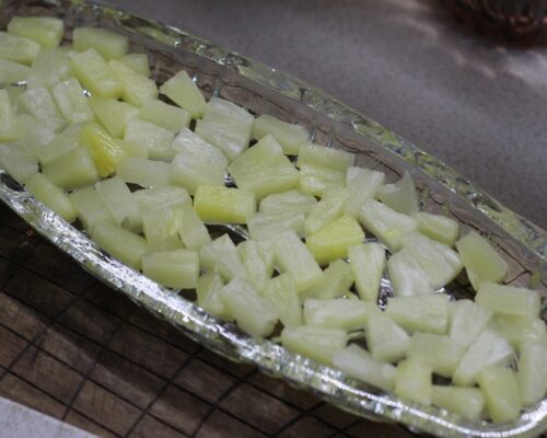 pineapple should be finely chopped and placed in a salad bowl