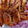 Shrimp garnished with lemon juice and garlic sauce