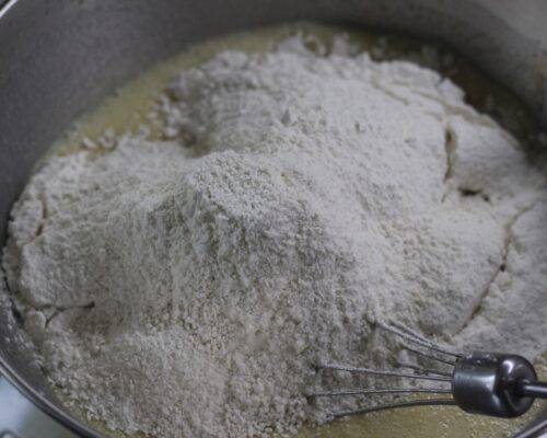 Add the baking powder and flour
