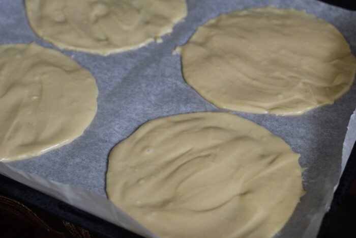 spread the dough on parchment paper