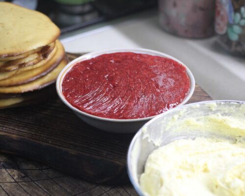 Assemble the cake by spreading the cream on the cakes