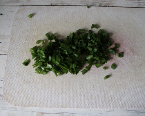 Wash the green onions and chop