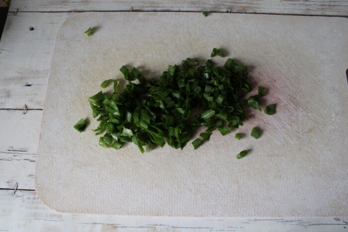 Wash the green onions and chop