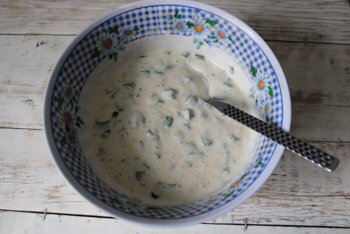 Add the herbs to the dough