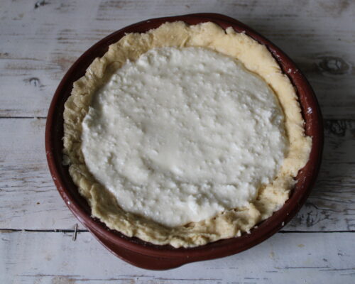 Pour the filling over the dough