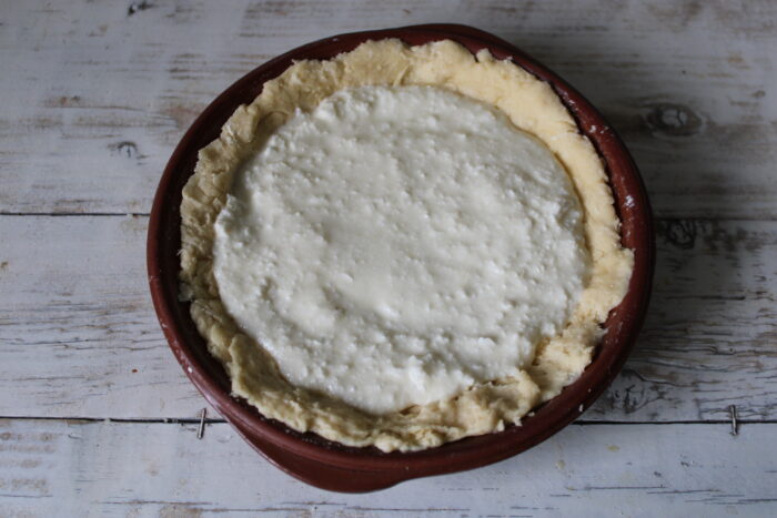 Pour the filling over the dough