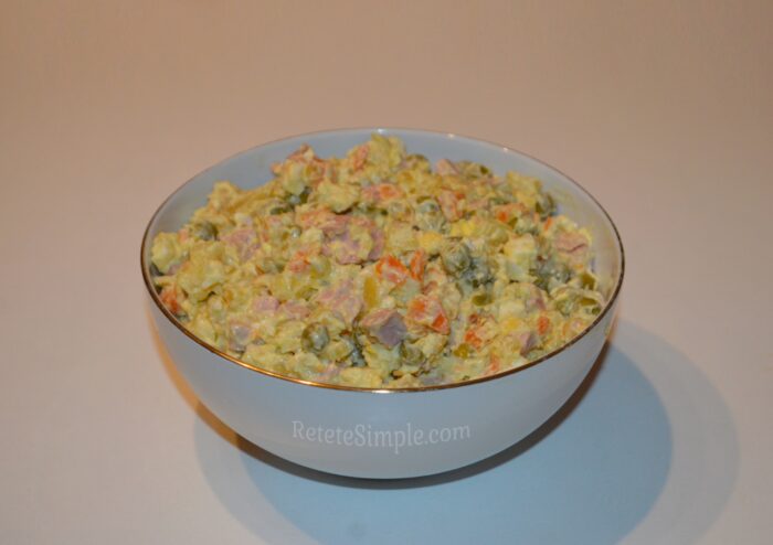 Olivier salad served on decorative plate
