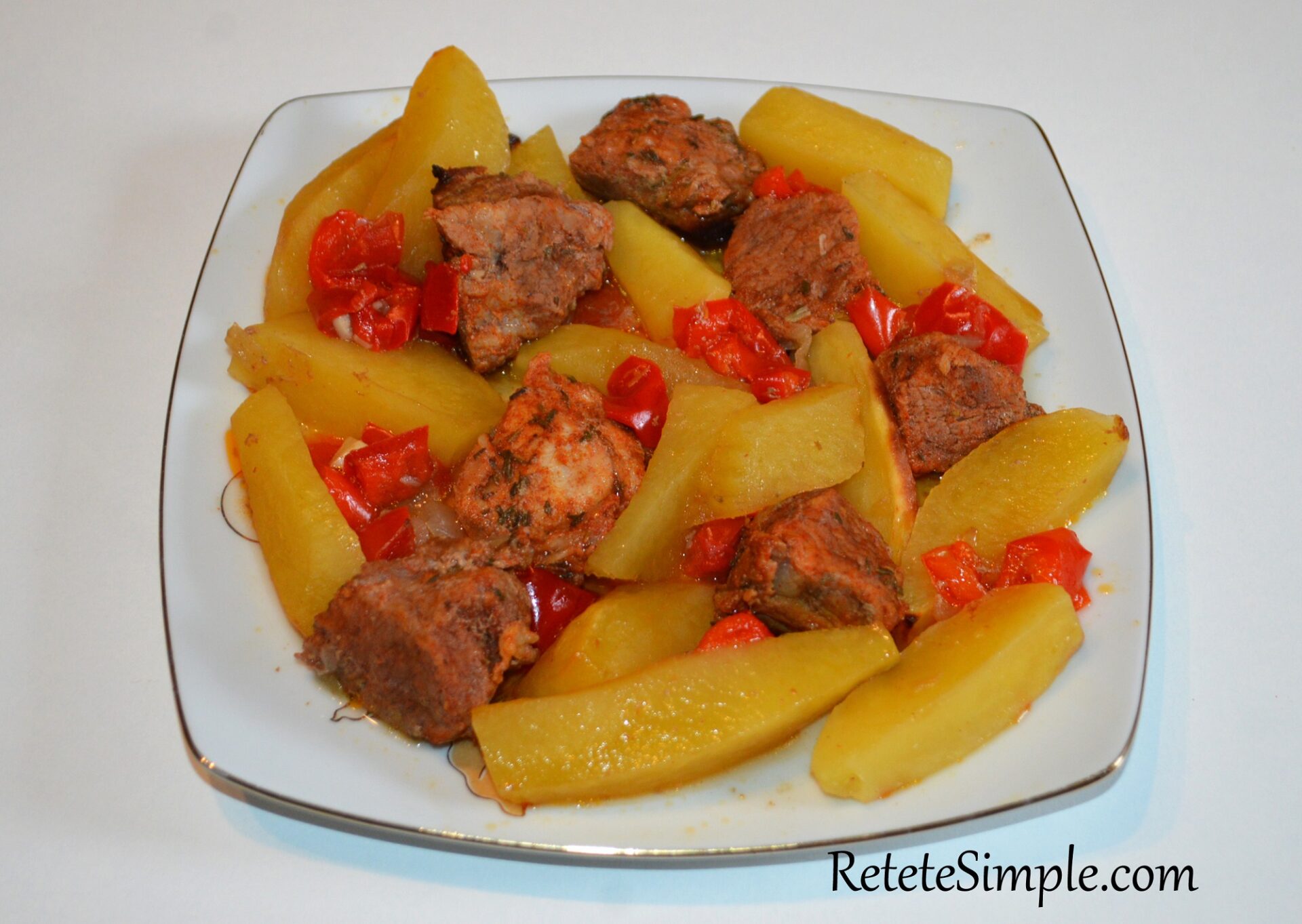 Roasted Pork with Garlic, Potatoes & Bell Peppers