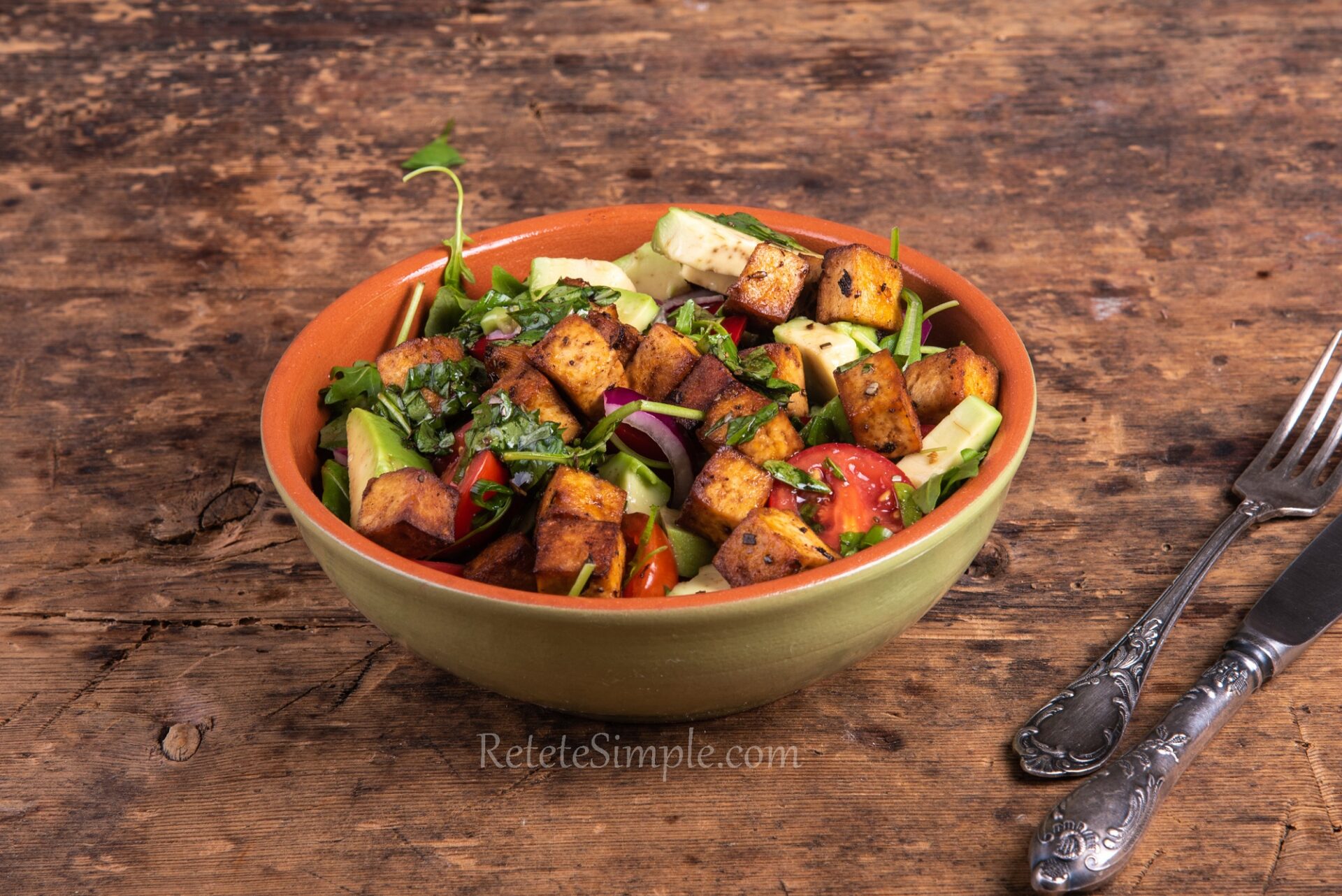 Crispy tofu and fresh vegetables in a soy-balsamic dressed bowl