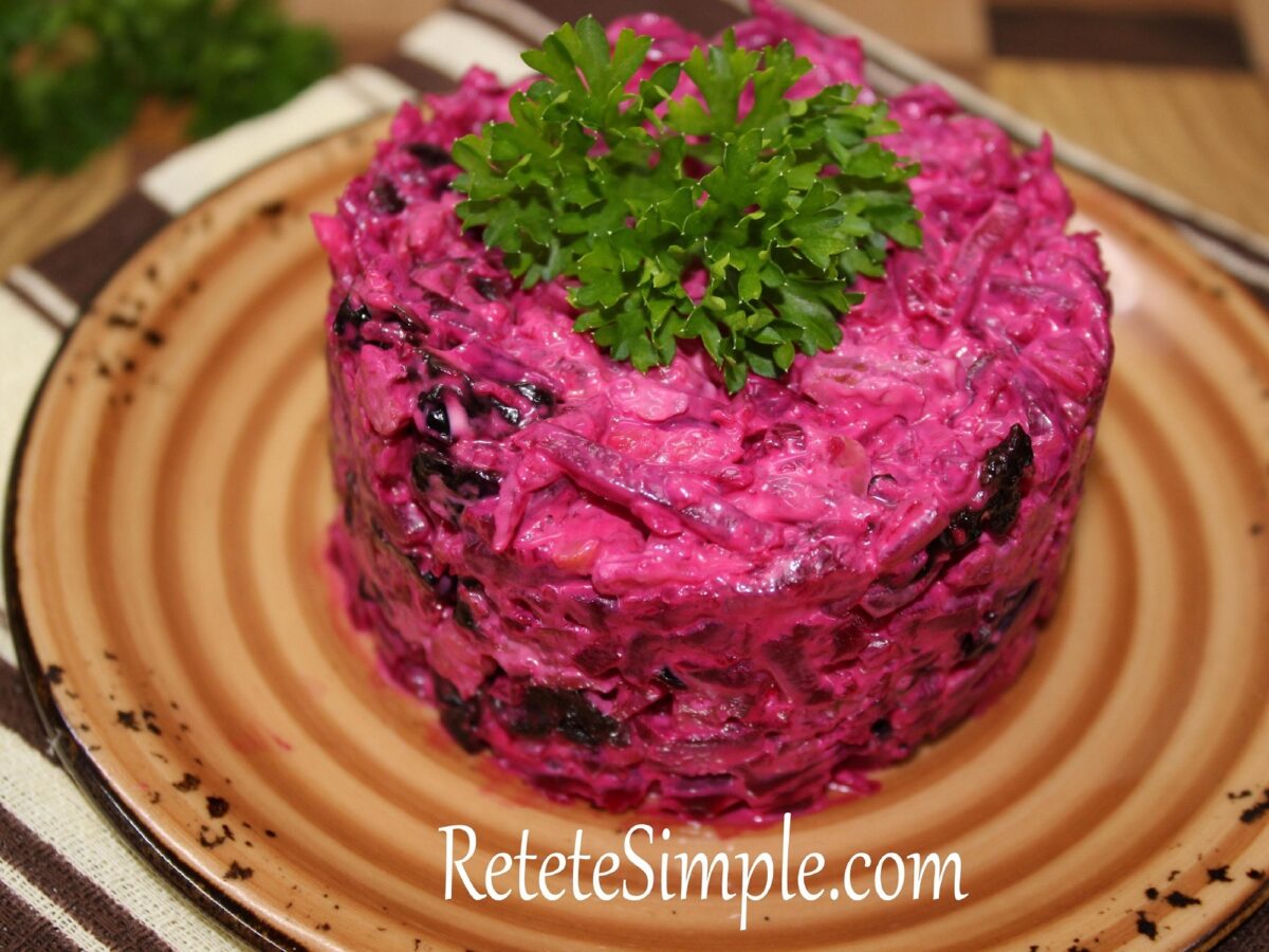 Festive beetroot salad layered in ring mold with parsley garnish