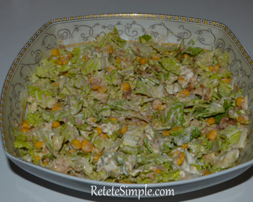 Crunchy cabbage salad topped with tuna and sweet corn