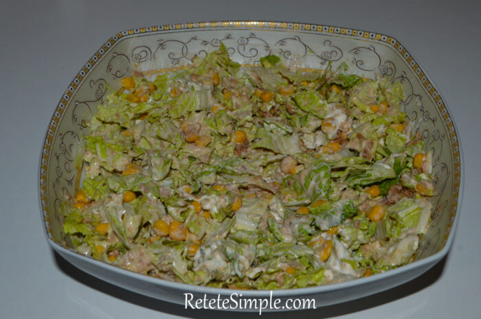 Crunchy cabbage salad topped with tuna and sweet corn