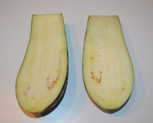 Wash the eggplant and cut it in half