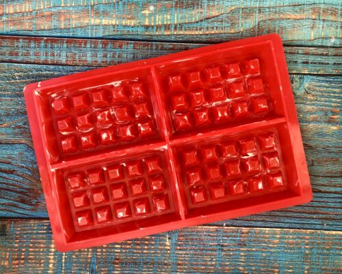 Grease a baking pan with a little melted butter