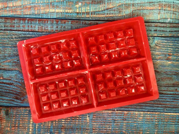 Grease a baking pan with a little melted butter