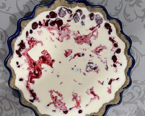 Pour the cream mixture over the cherries