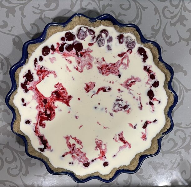 Pour the cream mixture over the cherries