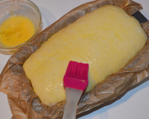 use a pastry brush to grease the bread