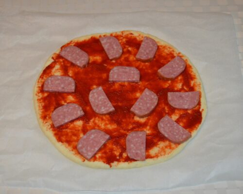 Arrange the sliced salami