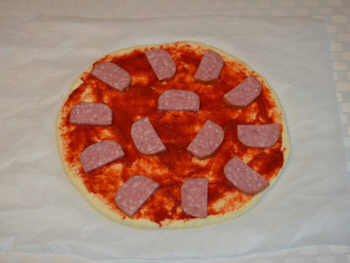 Arrange the sliced salami