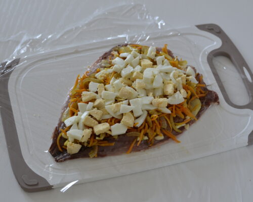 Place the chopped egg over the vegetables