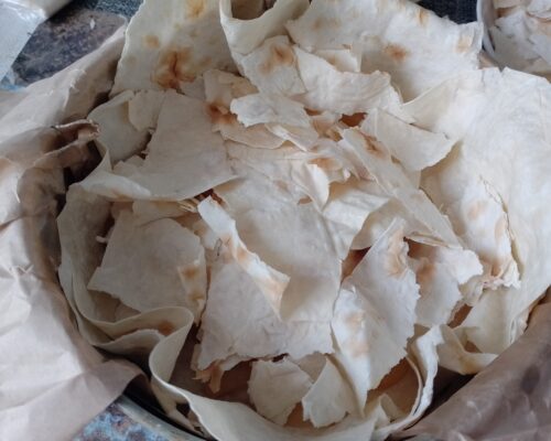 Cover the pie with the remaining large pieces of lavash