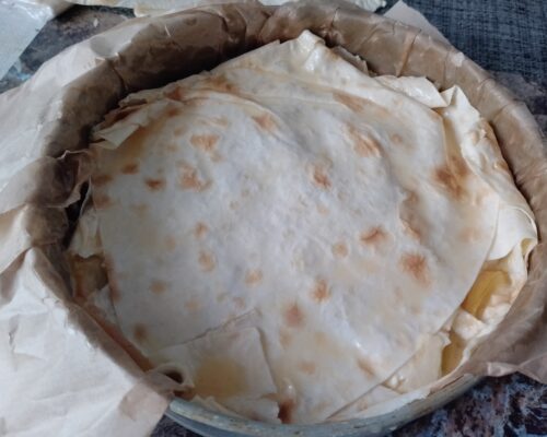 Grease the top with egg yolk