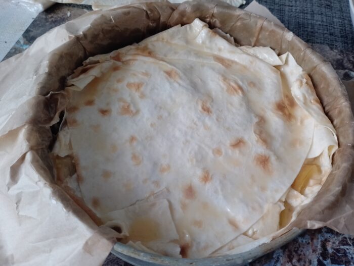 Grease the top with egg yolk