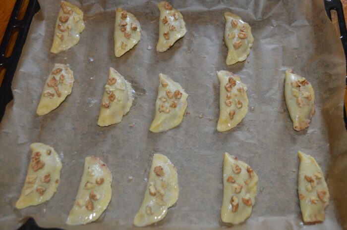 arrange small pieces of walnut on each crescent