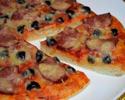 The pizza is ready, cut it and enjoy