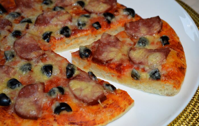 The pizza is ready, cut it and enjoy